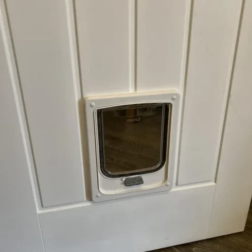 White wood fitting cat door installed on wood - Pet-Tek Catwalk cat flap for wooden doors